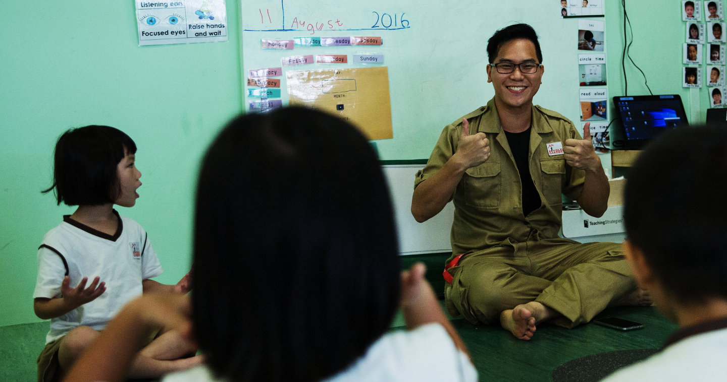 A AWWA Kindle Garden teacher engaging his students during lesson