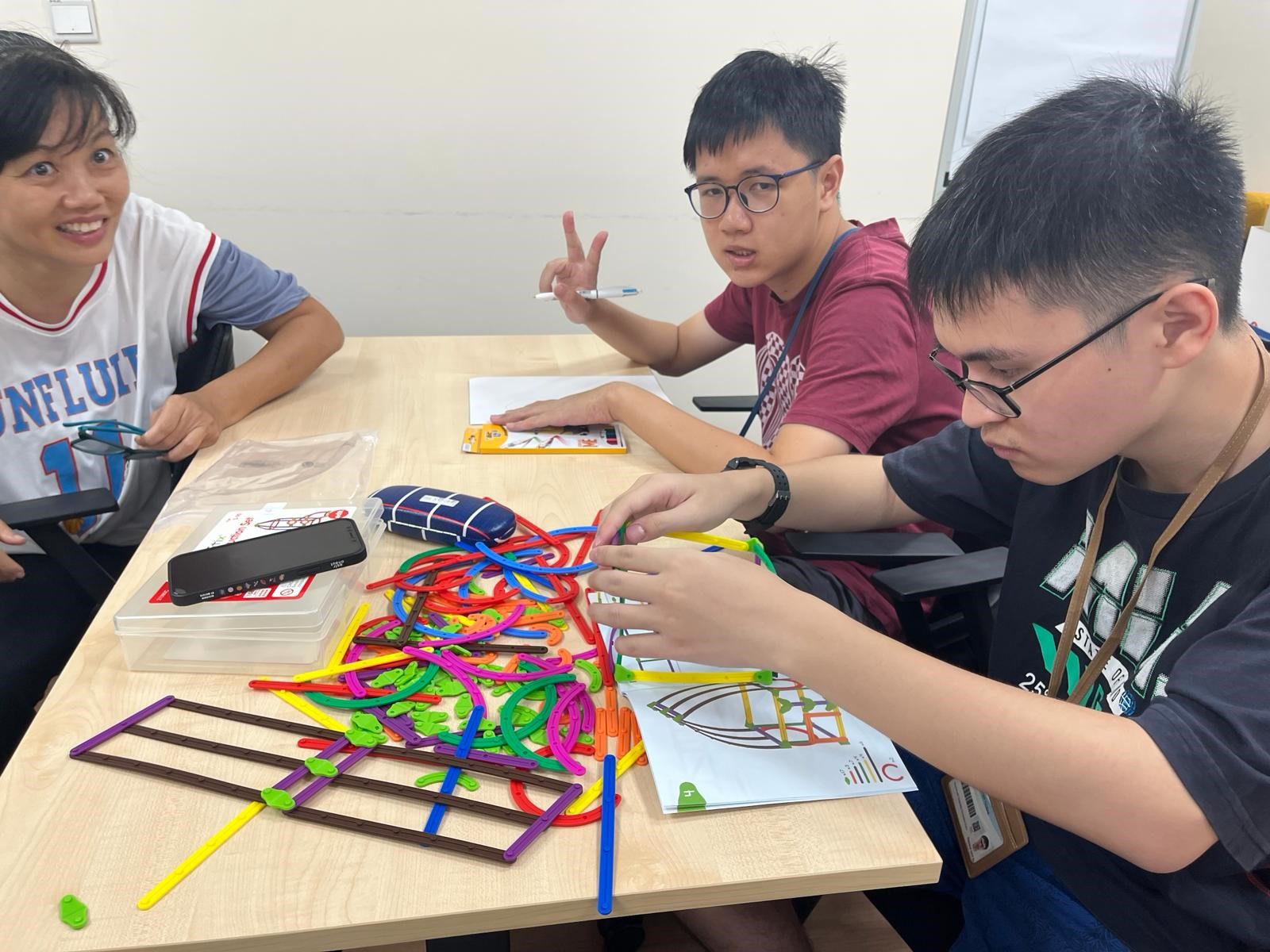 Lucas is enjoying himself in an Art and Craft session.