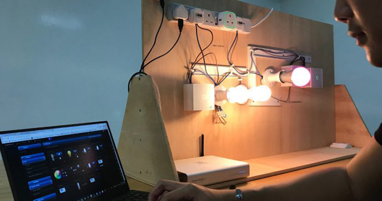 An individual recalibrating some Smart Home lights