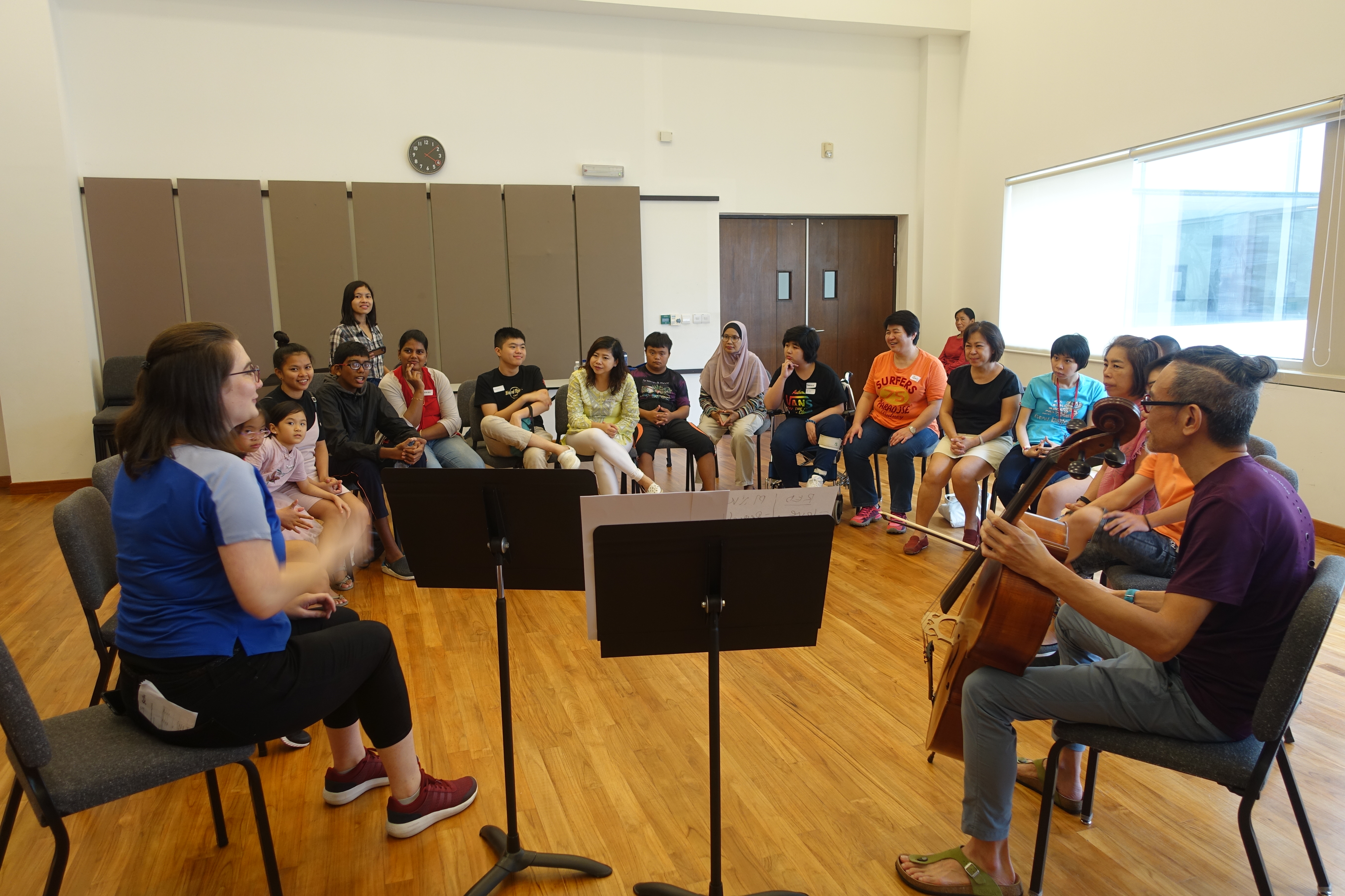 Project Artitude founder Leslie Tan (with cello) and YST Conservatory of Music alumnus Bethany Nette (extreme left) imparting musical skills to SSV during one of the workshops.
