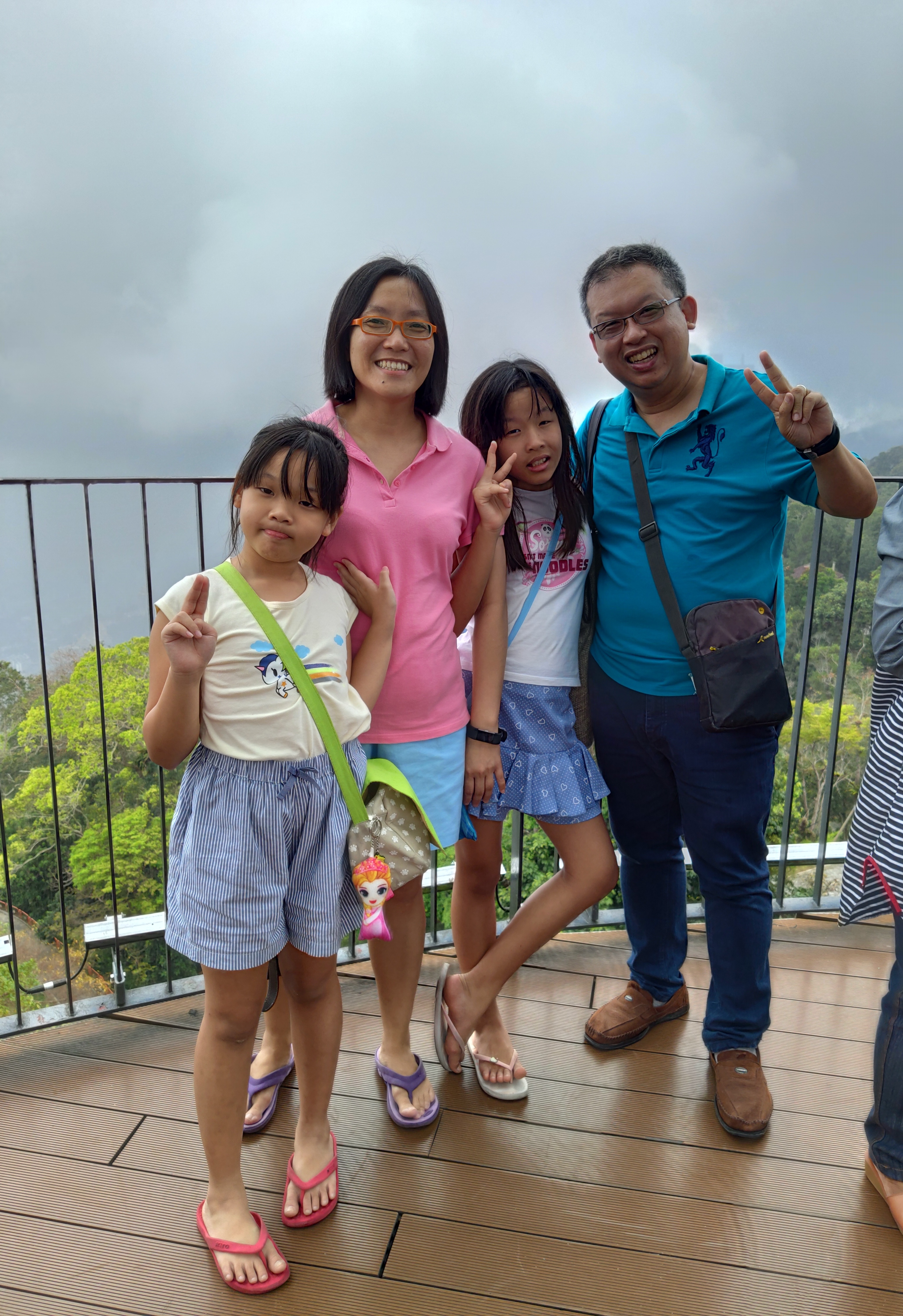 Edward, his wife, and his daughters during a family vacation to Penang Hill in Malaysia. Edward with his family during a vacation in Penang.