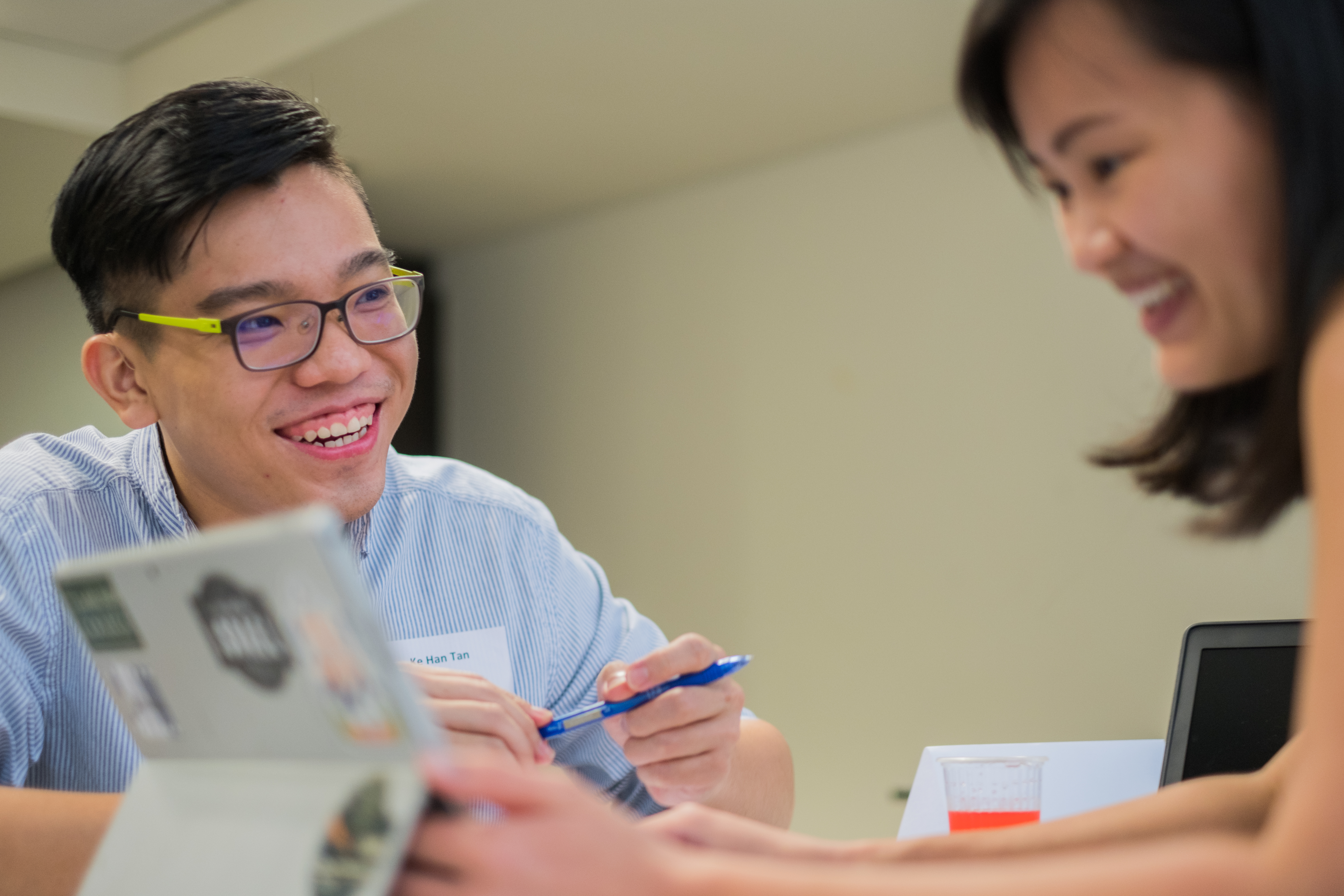 Photo of a man and a woman looking through their CV 