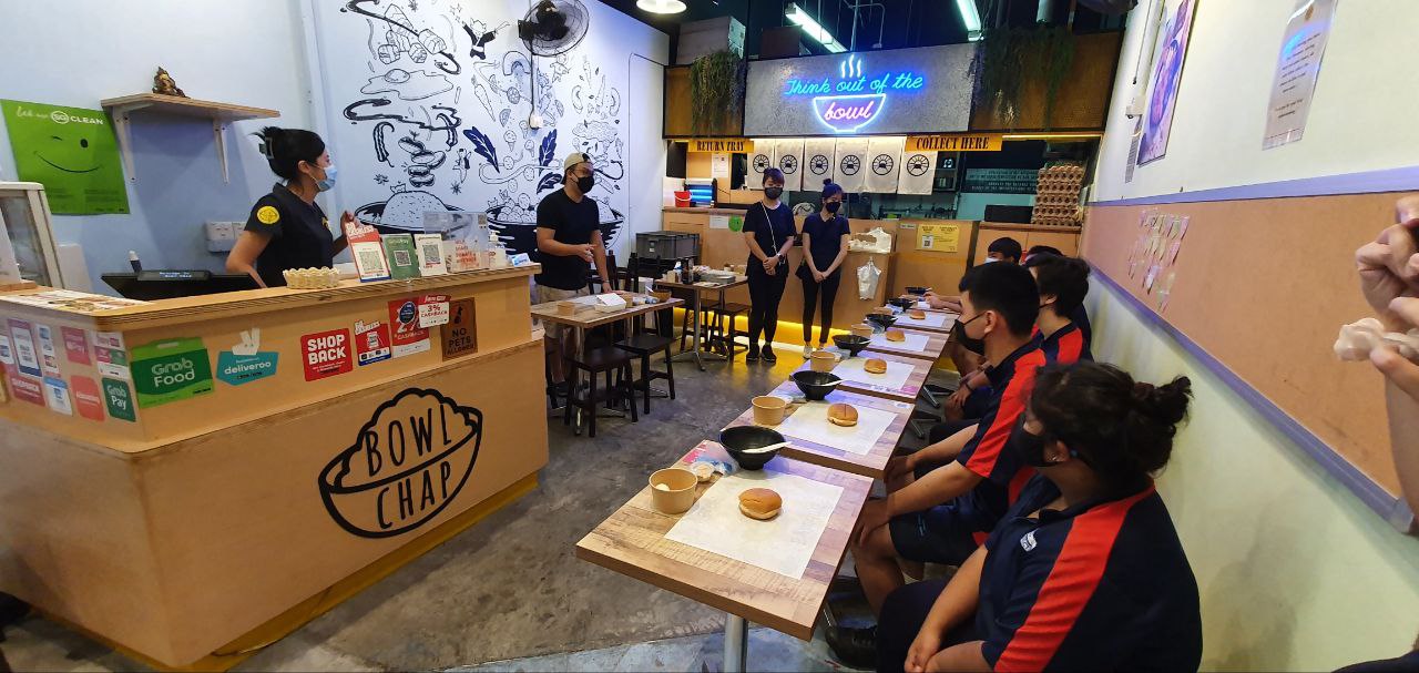 Students from Fernvale Gardens School participated in a sandwich-making activity guided by staff from Bowlchap.