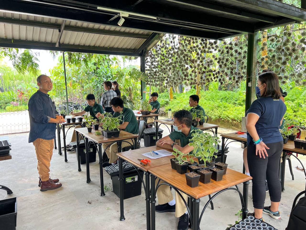 Students from Eden School engage in an activity planned by Tropic Planners on landscaping.